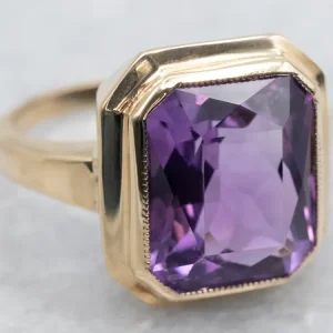 Yellow Gold Bezel Set Emerald Cut Amethyst Solitaire Ring