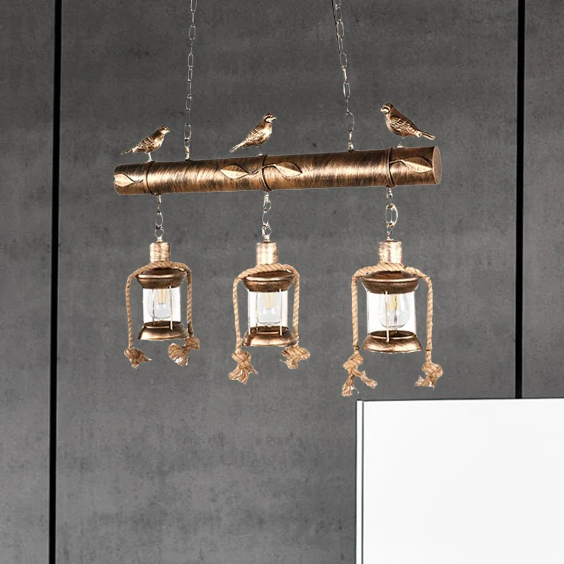 Coastal Lantern Island hanglampset met 3 lampen van helder glas antiek koper met vogel Clearhalo