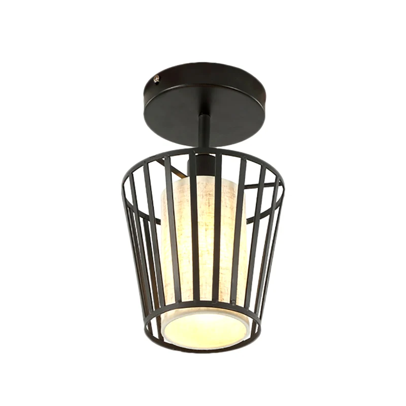 Een lichte cilinder/barrel semi-inbouw licht industrieel zwart metalen verlichtingsarmatuur voor gang met stoffen kap Clea...