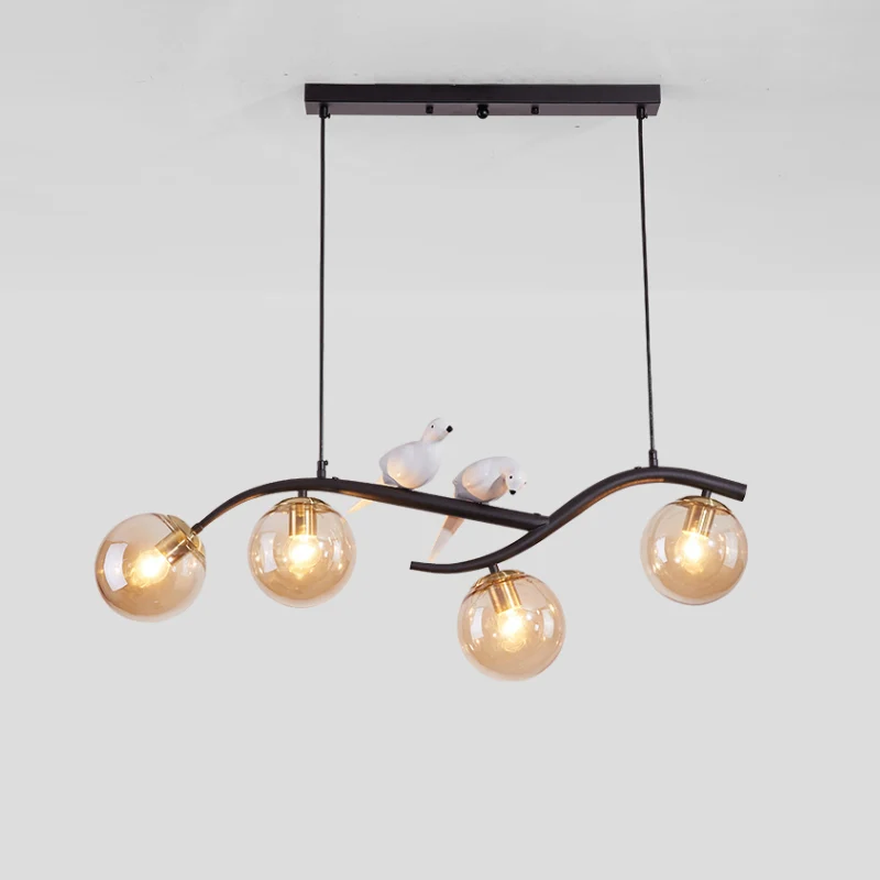 Metalen tak hanglamp eigentijds 4-lichts zwart/goud eilandhanger met vogeldeco en rookgrijs/cognac glazen kap Clearhalo