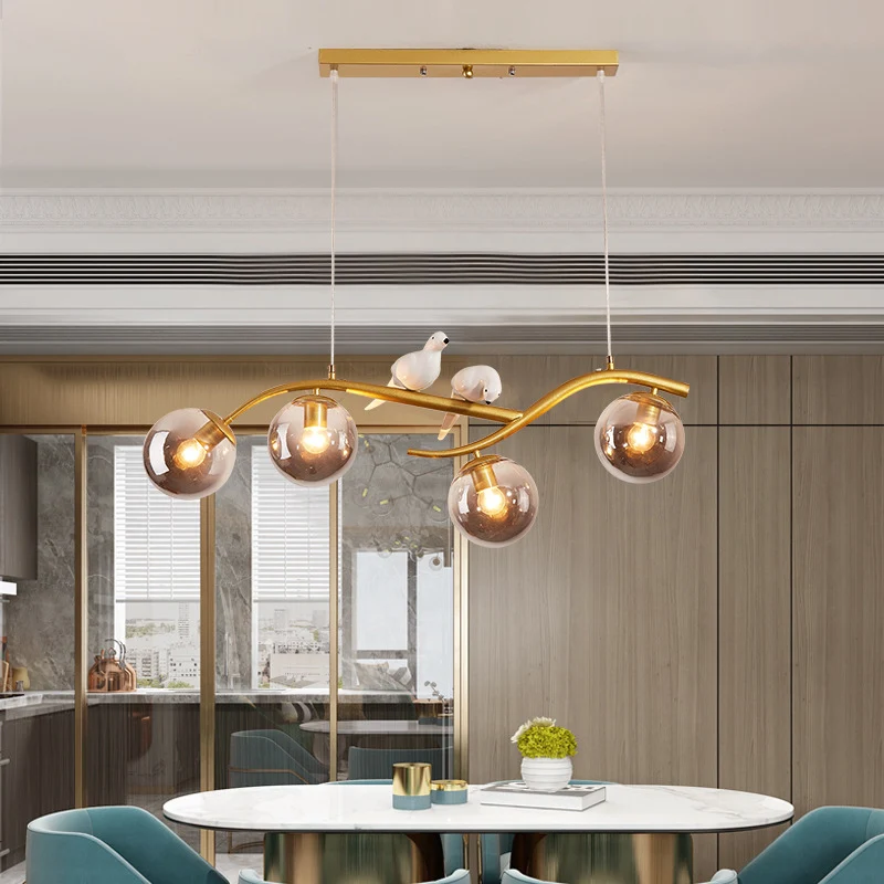 Metalen tak hanglamp eigentijds 4-lichts zwart/goud eilandhanger met vogeldeco en rookgrijs/cognac glazen kap Clearhalo