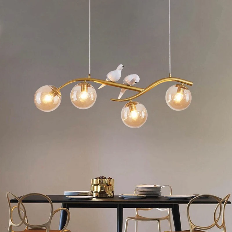 Metalen tak hanglamp eigentijds 4-lichts zwart/goud eilandhanger met vogeldeco en rookgrijs/cognac glazen kap Clearhalo