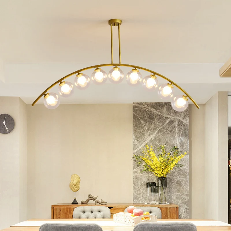 Mid-Century moderne gouden metalen eiland hanglamp bolvormige glazen eilandplafondlamp voor eettafel Clearhalo