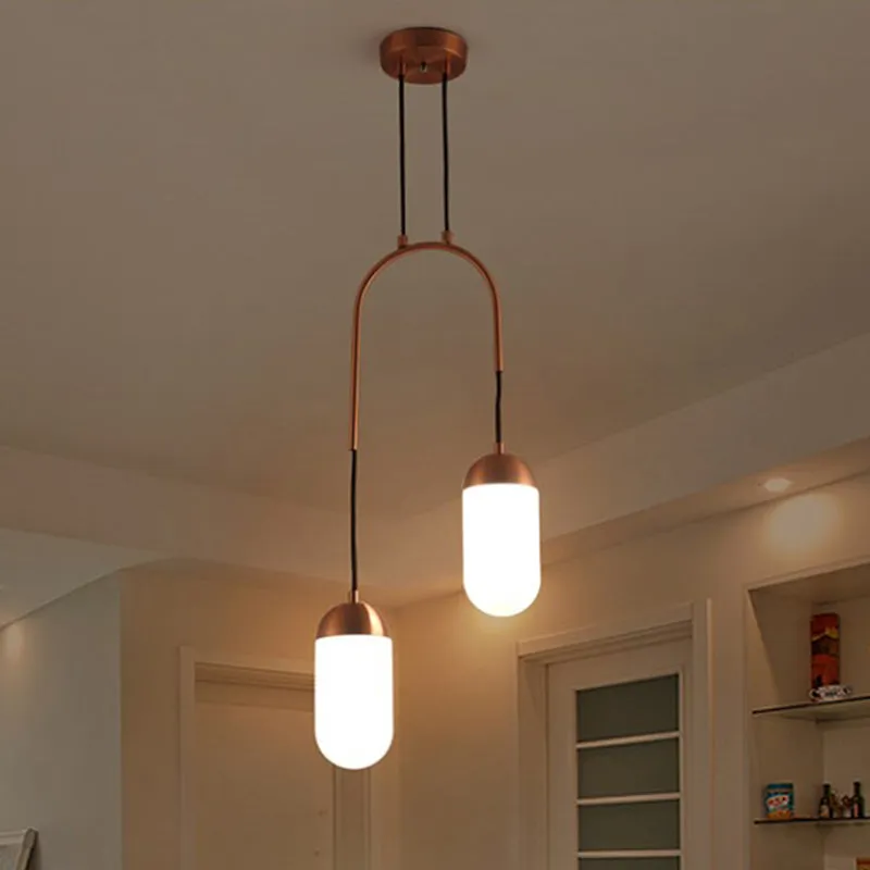Postmoderne capsule multi-plafondlamp wit glas 2-lichts boogvormige hanglamp bij het bed koper Clearhalo