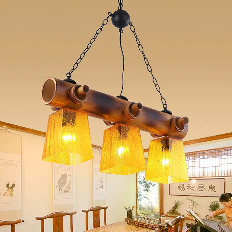 Trapeziumvormige gele waterglazen eilandlamp Countryside Eetkamerhanglamp met 3 lampen bruin met lineaire bamboebundel Cle...